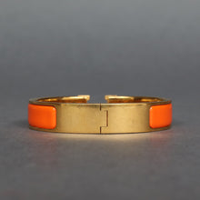 Load image into Gallery viewer, Vintage Hermès ‘clic clac’ bracelet with enamel & gold plate