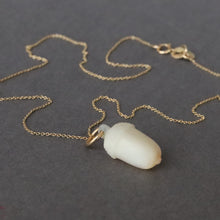 Load image into Gallery viewer, Antique victorian era acorn pendant charm carved from mother of pearl with a gold jumper ring. Symbol of growing love.