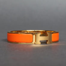 Load image into Gallery viewer, Vintage Hermès ‘clic clac’ bracelet with enamel & gold plate