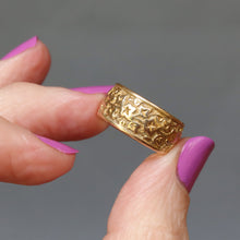 Load image into Gallery viewer, Antique Victorian era wide gold stacking band ring in 18ct gold. Antique wedding ring with embossed ivy leaf design around full circumference. Ivy leaf symbolising fidelity, loyalty, devotion. Anniversary gift ring.