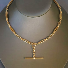 Load image into Gallery viewer, Antique Albert chain. Antique Victorian watch chain in 9ct yellow gold with fancy links. Heavy gold chain. Oval links. Floating T-bar fob. Dog clip closure. Medium length gold chain.