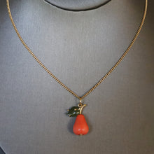 Load image into Gallery viewer, Vintage Italian coral figural pendant necklace in the shape of a pear with nephrite jade leaf and gold fittings. Vintage Italian curb link chain necklace in 18ct 18k yellow gold by UnoAErre. 1960s mid-century pear pendant and necklace.