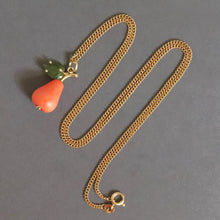Load image into Gallery viewer, Vintage Italian coral figural pendant necklace in the shape of a pear with nephrite jade leaf and gold fittings. Vintage Italian curb link chain necklace in 18ct 18k yellow gold by UnoAErre. 1960s mid-century pear pendant and necklace.
