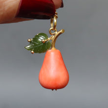 Load image into Gallery viewer, Vintage Italian coral figural pendant necklace in the shape of a pear with nephrite jade leaf and gold fittings. Vintage Italian curb link chain necklace in 18ct 18k yellow gold by UnoAErre. 1960s mid-century pear pendant and necklace.