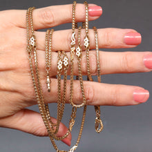 Load image into Gallery viewer, Long guard chain. Antique chain. Antique gold chain. Muff chain. Antique guard chain. Fancy link chain. Antique fancy link chain. Pierced link chain. Antique pierced link chain. Swivel clasp. Lobster clasp. Gold dog clip. Antique dog clip. Station link chain. Station chain.