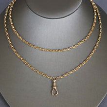 Load image into Gallery viewer, Antique Victorian long guard chain in 9ct 9k yellow gold with oval belcher links and dog clip.