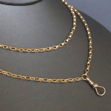 Load image into Gallery viewer, Antique Victorian long guard chain in 9ct 9k yellow gold with oval belcher links and dog clip.