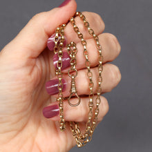 Load image into Gallery viewer, Antique Victorian long guard chain in 9ct 9k yellow gold with oval belcher links and dog clip.