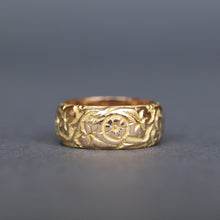 Load image into Gallery viewer, Antique Edwardian era wide gold stacking band ring in 9ct gold. Antique wedding ring with pansy and ivy leaf design around circumference. Ivy leaf symbolising fidelity, loyalty, devotion. Pansies for loving thoughts. Anniversary gift ring.