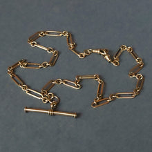 Load image into Gallery viewer, Vintage antique fetter link Albert watch chain in 9 carat yellow gold with t-bar fob and double dog clips. Double swivel clips. Antique vintage trombone link chain.