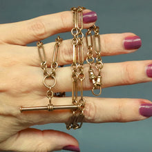 Load image into Gallery viewer, Vintage antique fetter link Albert watch chain in 9 carat yellow gold with t-bar fob and double dog clips. Double swivel clips. Antique vintage trombone link chain.