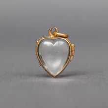 Load image into Gallery viewer, antique glass puffy heart locket dating Victorian era. Two glass leaves held in a hinged bracket with yellow gold gilding. It opens to allow flat items (photos, pressed flowers) to be placed inside.