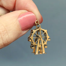 Load image into Gallery viewer, Vintage spinning ferris wheel charm in 14ct 14k yellow gold. Articluated ferris wheel pendant. Ferris wheel spins and cars carts swing. Whimsical gold charm.