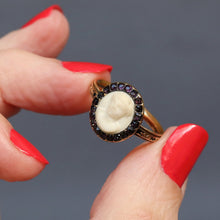 Load image into Gallery viewer, Antique mourning ring. Georgian mourning ring. Mourning ring with amethysts. Mourning ring with amethyst halo. Mourning ring with amethyst border. Mourning ring with marble bust. Mourning ring with marble cameo. White marble ring. Musuem quality ring. Georgian marble ring. Oval mourning ring. Black enamel ring. Antique black enamel ring. Memento mori ring. Memorial ring.