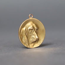 Load image into Gallery viewer, Antique art nouveau era French pendant with basset hound dog in relief. Circular circle disc pendant in 18ct yellow gold.
