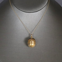 Load image into Gallery viewer, Antique ball pendant with hidden compartment in 15ct gold