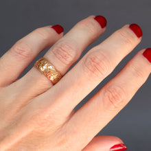 Load image into Gallery viewer, Antique Edwardian era wide wedding stacking band with ivy leaf engraving in 9ct yellow gold.