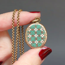 Load image into Gallery viewer, Antique blue green enamel locket. Antique enamel locket. Blue green enamel geometric locket. Victorian enamel locket. Victorian blue green enamel locket. Engraved ivy locket. Antique gold locket. Antique blue green enamel pendant. Antique enamel pendant. Victorian enamel pendant. Victorian blue green enamel pendant. Seafoam green enamel locket. Mint green enamel locket.