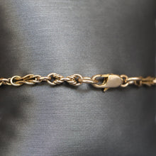 Load image into Gallery viewer, Vintage triple link knot bracelet in 9ct gold