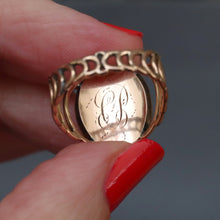 Load image into Gallery viewer, Antique Georgian sentimental ring with hairwork in a star pattern under crystal glass with a blue and white enamel border in 18ct rose gold. Oval shaped ring face. Band with arcs. CP initials. CP monogram. Mourning ring. Romantic antique ring.