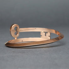 Load image into Gallery viewer, Vintage key shaped bypass bangle in 9ct rose gold