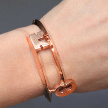 Load image into Gallery viewer, Vintage key shaped bypass bangle in 9ct rose gold