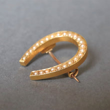 Load image into Gallery viewer, Antique Victorian era pearl horseshoe brooch in 15ct gold