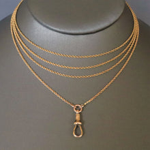Load image into Gallery viewer, Long guard chain. Antique chain. Antique gold chain. Muff chain. Antique guard chain. Rope link chain. Antique rope link chain. Twist link chain. Antique twist link chain. Swivel clasp.. Lobster clasp. Gold dog clip. Antique dog clip.