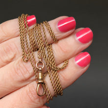 Load image into Gallery viewer, Long guard chain. Antique chain. Antique gold chain. Muff chain. Antique guard chain. Rope link chain. Antique rope link chain. Twist link chain. Antique twist link chain. Swivel clasp.. Lobster clasp. Gold dog clip. Antique dog clip.