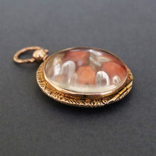 Load image into Gallery viewer, Antique Edwardian era locket in 9ct gold with garnets & sapphires