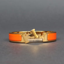 Load image into Gallery viewer, Vintage Hermès ‘clic clac’ bracelet with enamel &amp; gold plate
