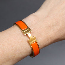 Load image into Gallery viewer, Vintage Hermès ‘clic clac’ bracelet with enamel &amp; gold plate
