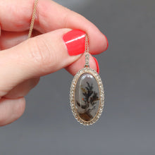 Load image into Gallery viewer, Antique art nouveau era dendritic agate pendant with diamond border in silver and gold. Oval shaped. Natural.
