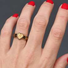 Load image into Gallery viewer, An antique gold mourning ring with a heart-shaped face engraved with a monogram CS and a band featuring black enamel sections with the words ‘In Memory Of’ and hairwork.
