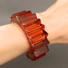 Load image into Gallery viewer, Vintage Prystal transparent Bakelite bangle cuff bracelet. Spiky spiked. Bold. Statement. Sculptural. Mid-century. Burnt orange colour.
