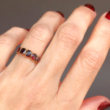 Load image into Gallery viewer, Antique Georgian flat cut garnet ring in 14ct yellow gold with engraved split shoulders. Oval garnets in a five stone half-hoop band. Foil-backed garnets. Foiled garnet ring.
