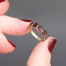 Load image into Gallery viewer, Antique Georgian flat cut garnet ring in 14ct yellow gold with engraved split shoulders. Oval garnets in a five stone half-hoop band. Foil-backed garnets. Foiled garnet ring.
