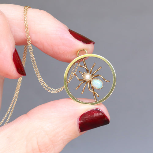 Vintage mid-century spider converter pendant brooch with engraved bow mount. Spider as an opal and pearl to the abdomen with gold body. Halloween jewellery jewelry jewels.