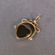 Load image into Gallery viewer, Vintage heart-shaped spinner fob pendant with rotating heart set with onyx and bloodstone in a 9ct yellow gold arched frame.
