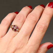 Load image into Gallery viewer, Antique Victorian era cluster ring with oval cut garnets and old cut diamonds in a flower design with a rose gold band.
