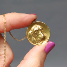 Load image into Gallery viewer, Antique art nouveau era French pendant with basset hound dog in relief. Circular circle disc pendant in 18ct yellow gold.
