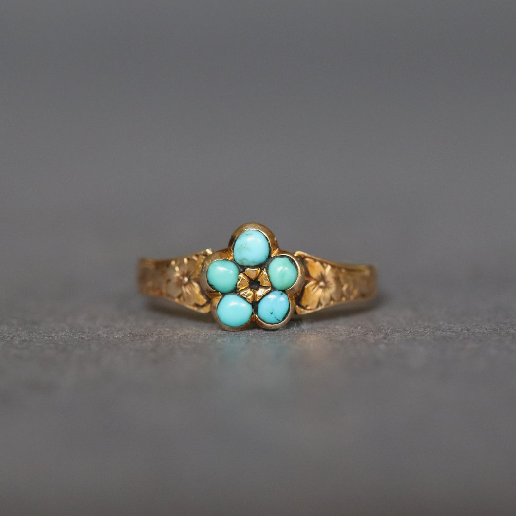 Antique Victorian era turquoise ring with pansy motif and floral engraved band. Pinky sized.