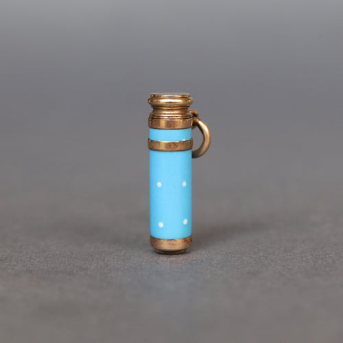 Antique Victorian era enamel cylinder pendant in bright blue with polka dots, containing a telescopic propelling pencil.