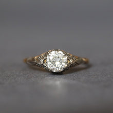 Load image into Gallery viewer, Antique diamond solitaire ring. Prong setting. Openwork gallery. Platinum and gold band. Cathedral. Round early brilliant cut. Antique engagement ring.
