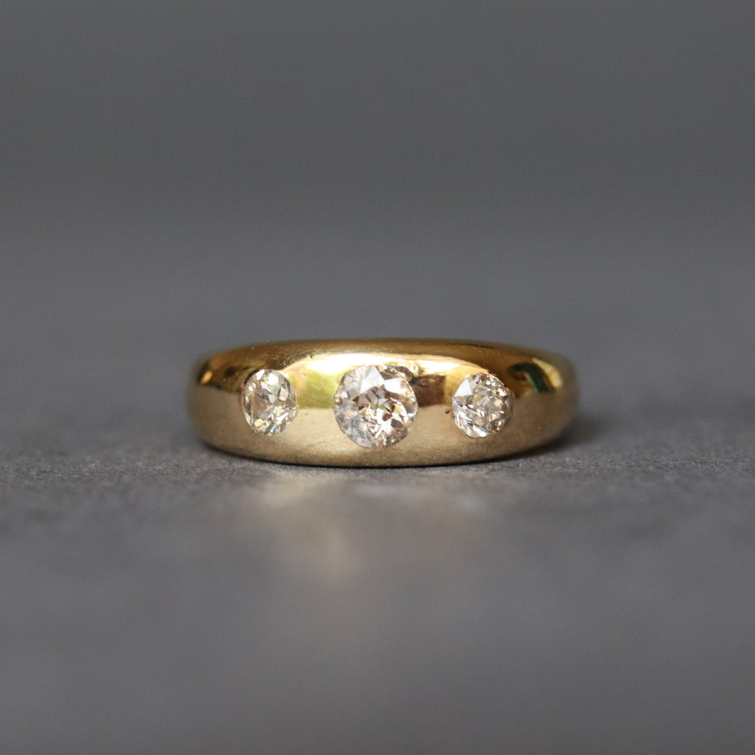 Antique three stone stacking band ring, with old cut diamonds (0.4ct) in a gypsy setting. D-shaped. 