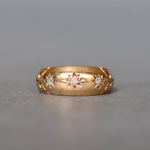 Antique Edwardian era three stone diamond gypsy stacking ring band with star setting in 18ct yellow gold and engraving to shoulders.