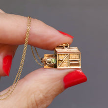 Load image into Gallery viewer, Vintage mid-century pigsty charm pendant. Articulated pig pops out of sty with a four leaf clover in his mouth. 9k 9ct gold.
