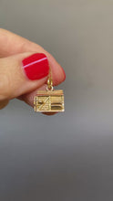 Load and play video in Gallery viewer, Vintage mid-century pigsty charm pendant. Articulated pig pops out of sty with a four leaf clover in his mouth. 9k 9ct gold.
