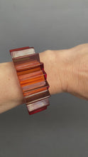 Load and play video in Gallery viewer, Vintage Prystal transparent Bakelite bangle cuff bracelet. Spiky spiked. Bold. Statement. Sculptural. Mid-century. Burnt orange colour.
