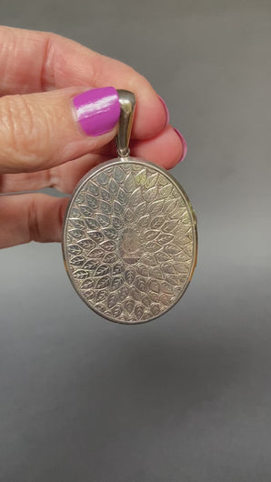 Large antique Victorian era oval shaped locket with leaf design and monogram CM or MC in sterling silver.